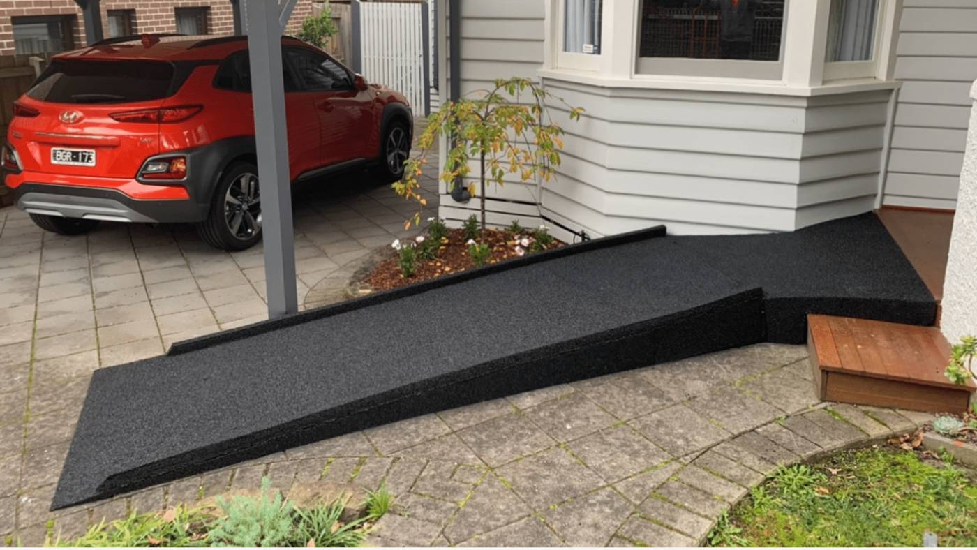 Custom recycled rubber wheelchair ramp leading to a Melbourne home front entry