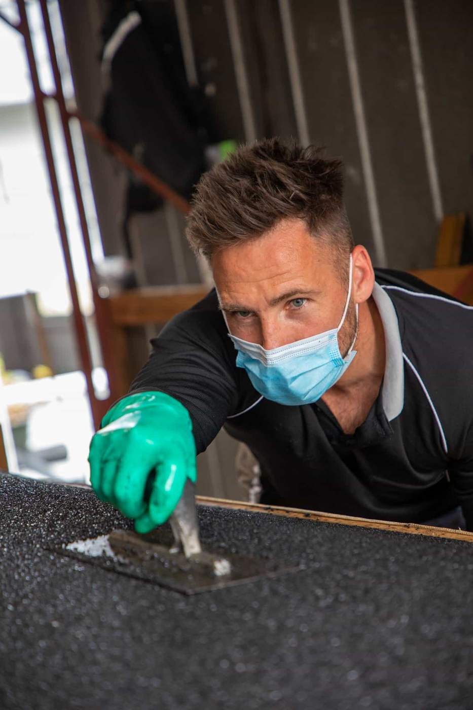 Hand-finishing a custom rubber ramp Ramps R Us maker hand-finishing a custom rubber ramp in Melbourne