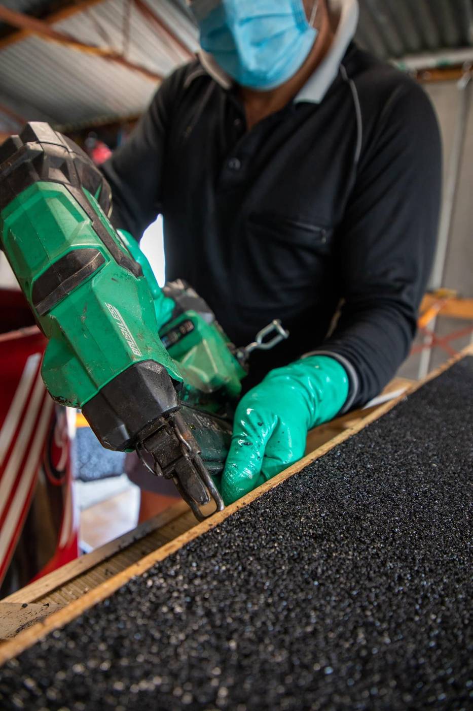 Technician fixing the timber form for a custom rubber ramp